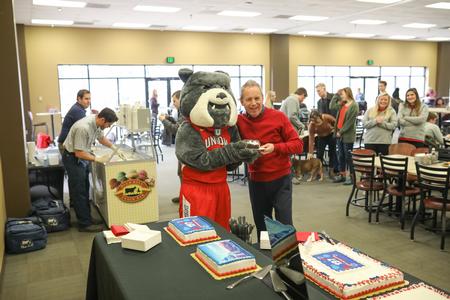 Buster and Dub Oliver, president of the university, pose together during the celebration of Union University's birthday in the Brewer Dining Hall. - Photo by Kristi McMurry Woody