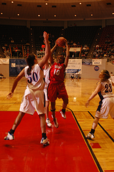 Ena Daniels (10) attempts a short jumper in the lane during the first round of the 2005 NAIA National Tournament. - Photo by Morris Abernathy