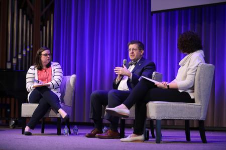 Julie Bradfield, senior director for university ministries & director for student mobilization, interviews Ray Van Neste, dean of the school of theology & missions, and Erin Slater, director of the center for academic success, during chapel. - Photo by Kristi McMurry Woody