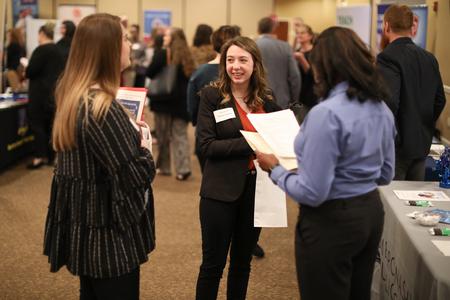 Kathryn Mascolo, interdisciplinary studies major, talks to recruiters at the Education Expo in the Grant Events Center. - Photo by Kristi McMurry Woody
