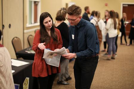 Euan Morton, physical education and health major, talks to recruiters from the area during the Education Expo. - Photo by Kristi McMurry Woody