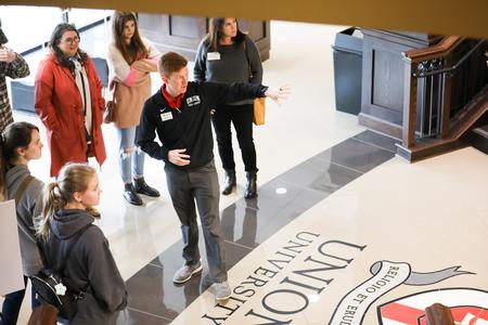 Bailey Bell, senior enrollment counselor, leads a tour through the Logos during a Day at the U tour. - Photo by Kristi McMurry Woody