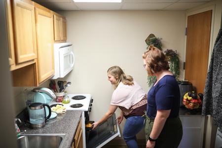 Students enjoy cooking in their dorm room kitchen. - Photo by Kristi McMurry Woody
