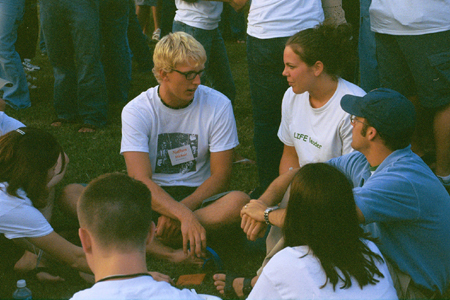 Freshman Engineering major Nathan Michaels chats with Senior Regan Carfield and Director of Discipleship Ministries Jay Ridenour and other fellow classmates during New Student Orientation 2002.  - Photo by Kristen Hiller