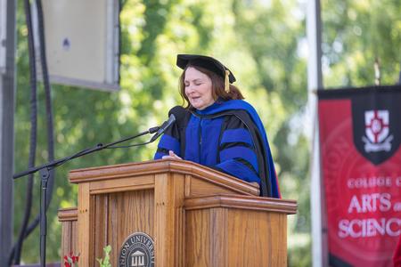 Terry Blakley, professor of social work, delivers the invocation at Spring Commencement. - Photo by Kristi McMurry Woody