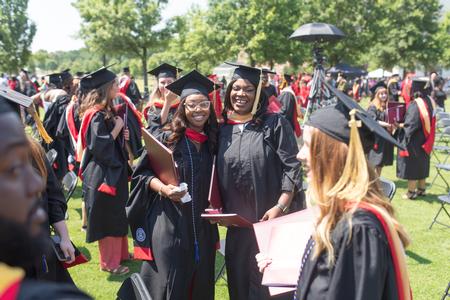 Graduates celebrate together after receiving their diplomas. - Photo by Kristi McMurry Woody