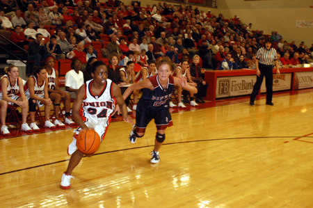 Senior guard Monica Elliot (24) drives past a Lyon College defender in a win during Homecoming Week. - Photo by Morris Abernathy