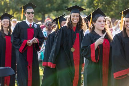Graduates process into Spring Commencement on the Great Lawn. - Photo by Kristi McMurry Woody