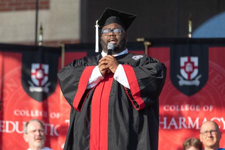 Cameron Smith, music graduate, performs during Spring Commencement. - Photo by Kristi McMurry Woody
