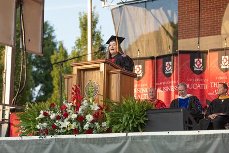 Jaime May, president of the senior class, presents the class of 2020 gift at the end of Spring Commencement. - Photo by Kristi McMurry Woody