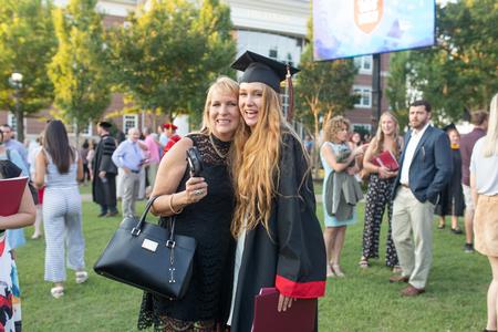 Students celebrate with their friends and family after Spring Commencement. - Photo by Kristi McMurry Woody