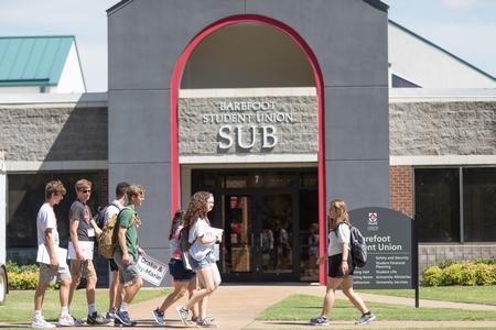 New students and their families go on a tour of campus during New Student Orientation. - Photo by Kristi McMurry Woody