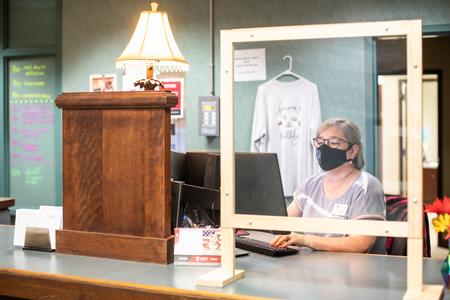 Leigh Anne Huisingh, Union Station associate, works behind the desk at Union Station. - Photo by Kristi McMurry Woody