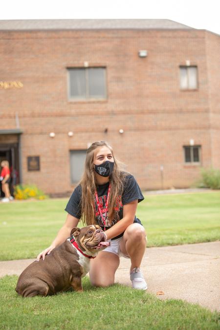 Buster the Bulldog poses with a student during New Student Move-in Day. - Photo by Kristi McMurry Woody