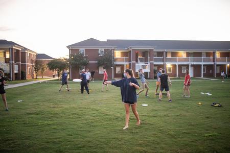 Students enjoy tossing the frisbee during the Labor Day Block Party outside the Bowld Commons. - Photo by Kristi McMurry Woody