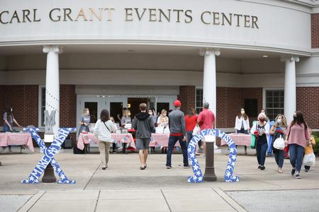 The women of Chi Omega pass out meals for their annual Make-A-Wish picnic during Family Weekend. - Photo by Kristi McMurry Woody