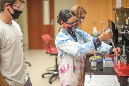 Betsy Caceres, assistant professor of chemistry, teaches a chemistry lab.  - Photo by Kristi McMurry Woody