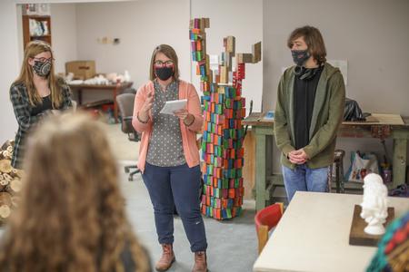 Paige Ward, instructional art staff, leads a sculpture critique as part of a cross-discipline project with the engineering department. - Photo by Kristi McMurry Woody