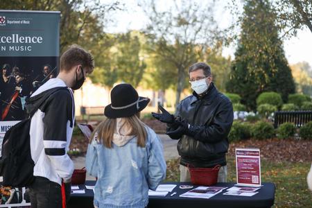 John Kinchen, professor of music and chair of the department, speaks with prospective students and their families during Day at the U. - Photo by Kristi McMurry Woody