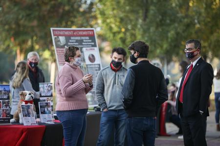 Prospective students and their families chat with members of the McAfee School of Business during Day at the U. - Photo by Kristi McMurry Woody