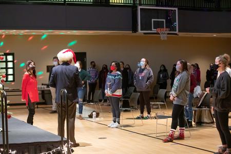 Dub and Susie Oliver, president and first lady of the university, sing Christmas carols with students during Christmas with the Olivers. - Photo by Kristi McMurry Woody
