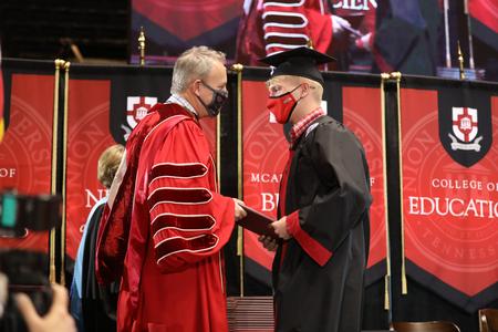 Students receive their diplomas during Fall Graduation. - Photo by Kristi McMurry Woody