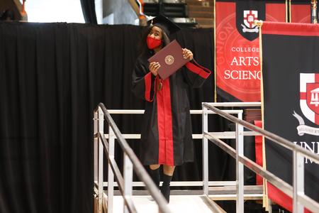 Kelsey Yarbrough, social work graduate, celebrates receiving her diploma during Fall Gradution. - Photo by Kristi McMurry Woody