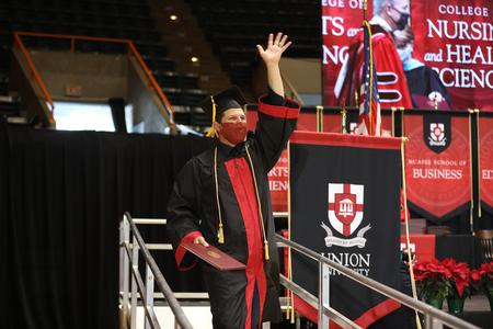 Students celebrate receiving diplomas during Fall Graduation. - Photo by Kristi McMurry Woody