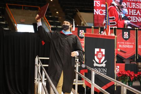 Students receive their diplomas during Fall Graduation. - Photo by Kristi McMurry Woody