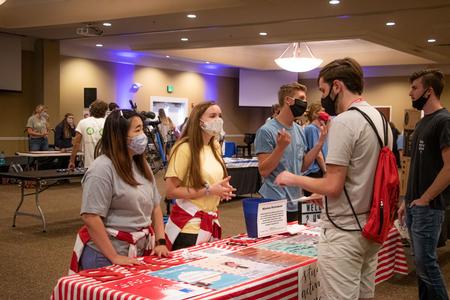 New students talk with representatives from Student Activities Council during the Welcome Week student life fair. - Photo by Joey Echeverria
