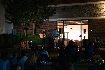 Students enjoy an outdoor Barefoots Joe concert. - Photo by Joey Echeverria