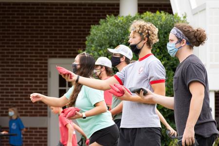 Students and their families enjoy a cornhole tournament during Family Weekend. - Photo by Naomi Mengel