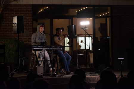 Student perform outside Barefoots Joe during Open Mic Night. - Photo by Naomi Mengel