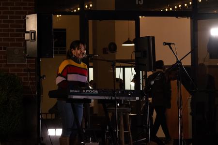 Eunice Tan, English major, performs during Open Mic Night. - Photo by Naomi Mengel