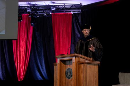 Steve Halla, faculty member of the year, speaks in chapel. - Photo by Joey Echeverria