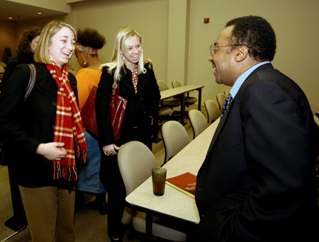 Clarence Page talks with Cardinal & Cream editors Heather Hagood (left) and Jill Martin during his March 8 visit to the Union campus. - Photo by Morris Abernathy