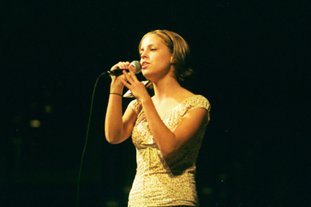 Freshman Amanda Raley sings in the Variety Show during New Student Orientation 2002. - Photo by Kristen Hiller