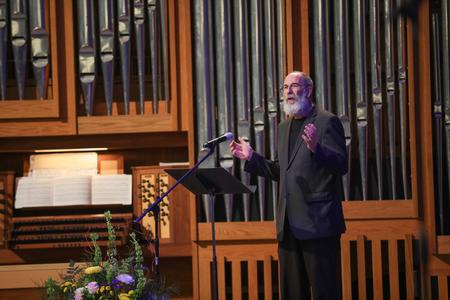 Terry McRoberts welcomes guests to the Carolyn Townsend McAfee Concert, where he is the guest performer. - Photo by Kristi McMurry Woody