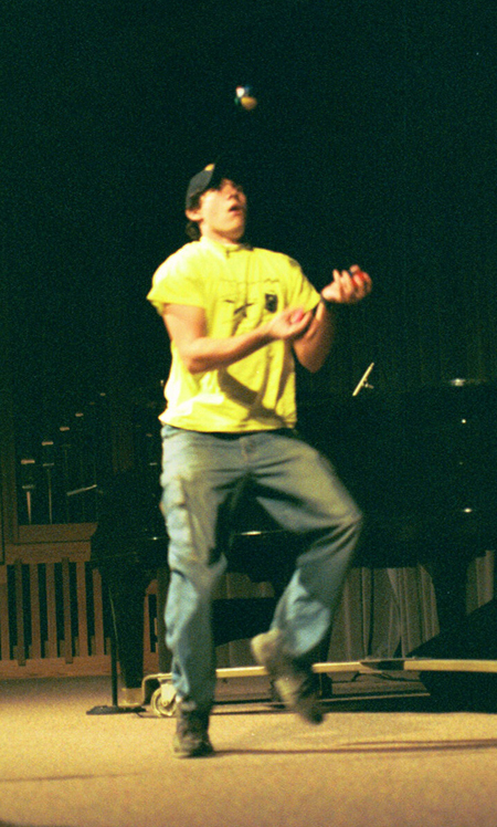 Freshman Wesley Calvert juggles at the Variety Show during New Student Orientation 2002. - Photo by Kristen Hiller
