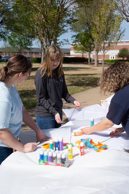 Student decorate kites during a Student Activities Council kite flying event. - Photo by Naomi Mengel