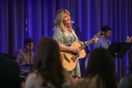 Ashley Cook, worship leadership graduate, performs with other students during the Graduation Commissioning Service. - Photo by Kristi McMurry Woody