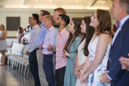 Graduates sing during the Graduation Commissioning Service. - Photo by Kristi McMurry Woody