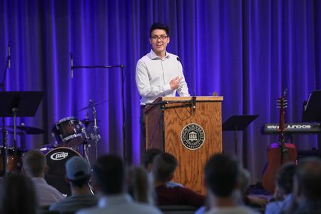 Raymond Chahyadi, economics graduate, speaks during the Graduation Commissioning Ceremony. - Photo by Kristi McMurry Woody