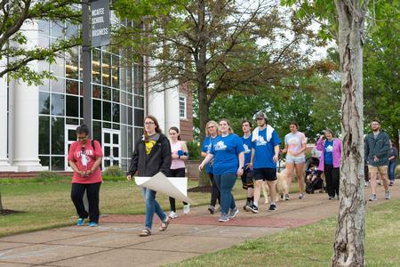 Participants walk in the Stomp Out Stigma 5K. - Photo by Naomi Mengel