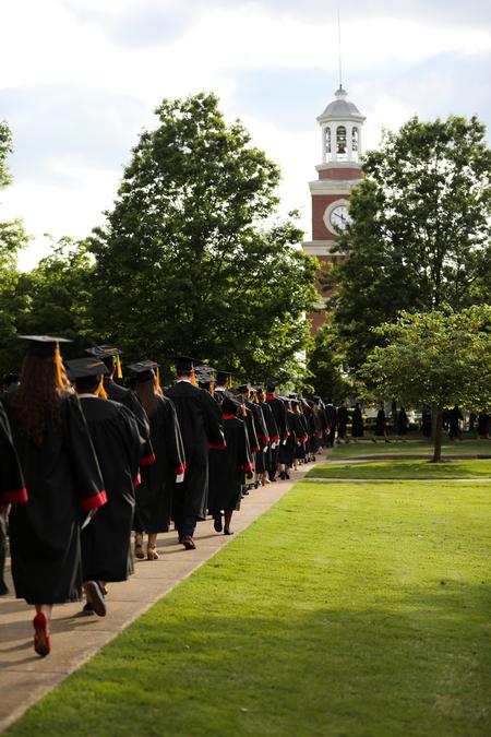 Students process to the Great Lawn for spring commencement. - Photo by Kristi McMurry Woody