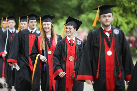 Graduates process to the Great Lawn for spring commencement. - Photo by Kristi McMurry Woody