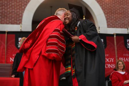 Jadelynne Greene, social work graduate, receives her diploma during spring commencement. - Photo by Kristi McMurry Woody