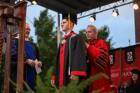 Jonathan Van Neste, physics graduate, receives the 110th Tigrett Medal at the end of spring commencement. - Photo by Kristi McMurry Woody