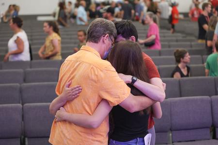 The Blair family shares a family hug at the conclusion of the Blessing Chapel during Welcome Week. - Photo by Kristi McMurry Woody