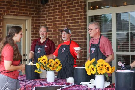 8/14/21 - John Netland, Dan Griffin and Todd Brady serve ice cream to new students during Welcome Week. - Kristi McMurry Woody